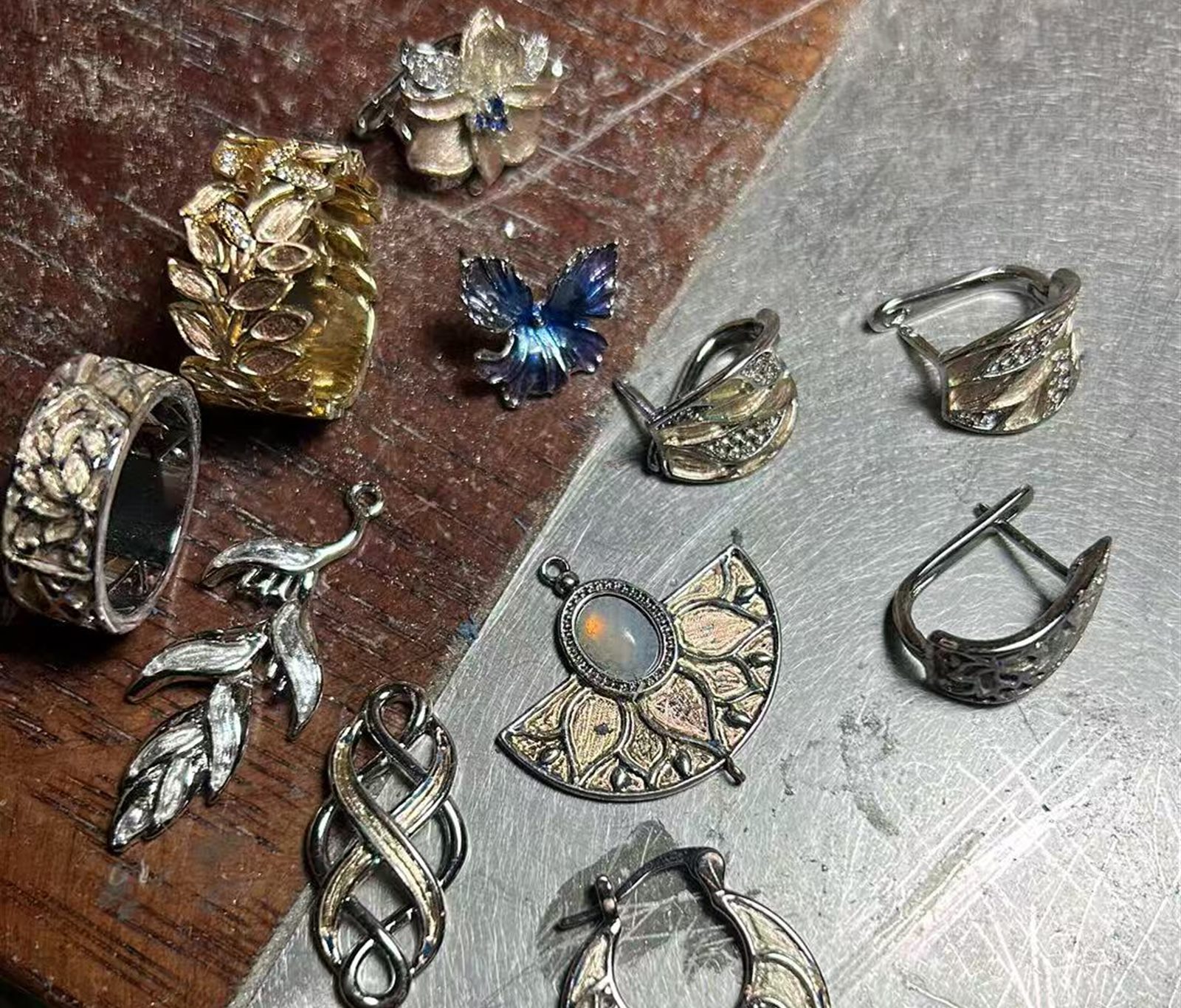 Unfinished silver pieces resting on the workbench at YÀN · Yunnan Studio