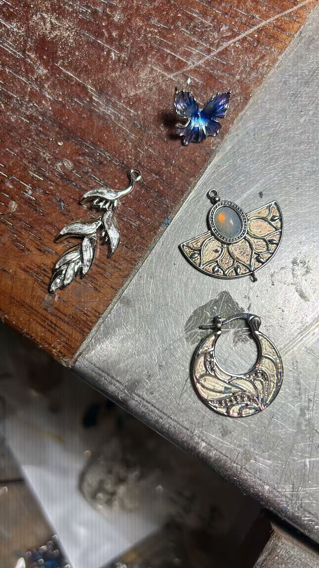 Hand-made pieces resting on the Hai Tang Wan atelier workbench